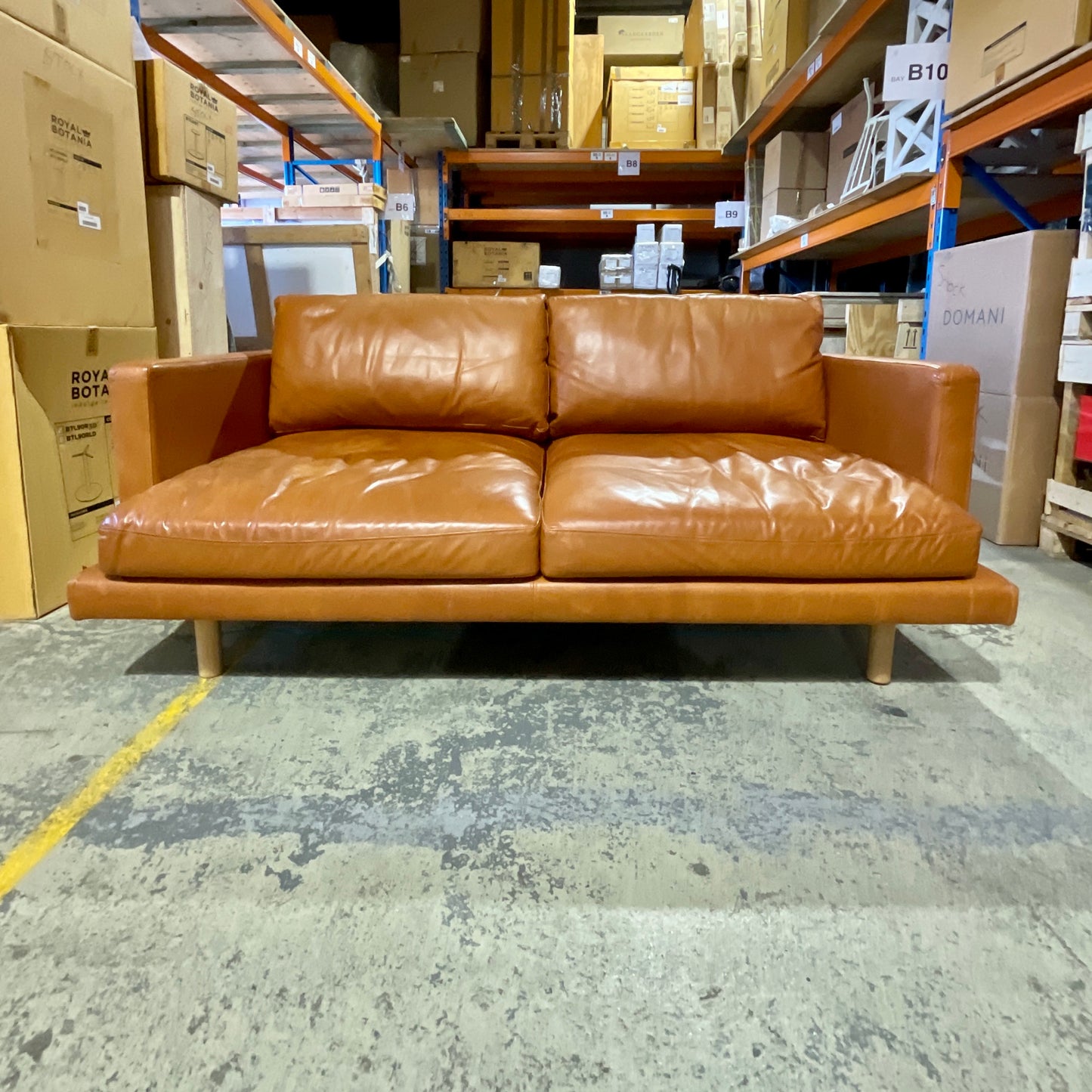 Domo leather sofa in brown, angled view - pre-owned designer furniture