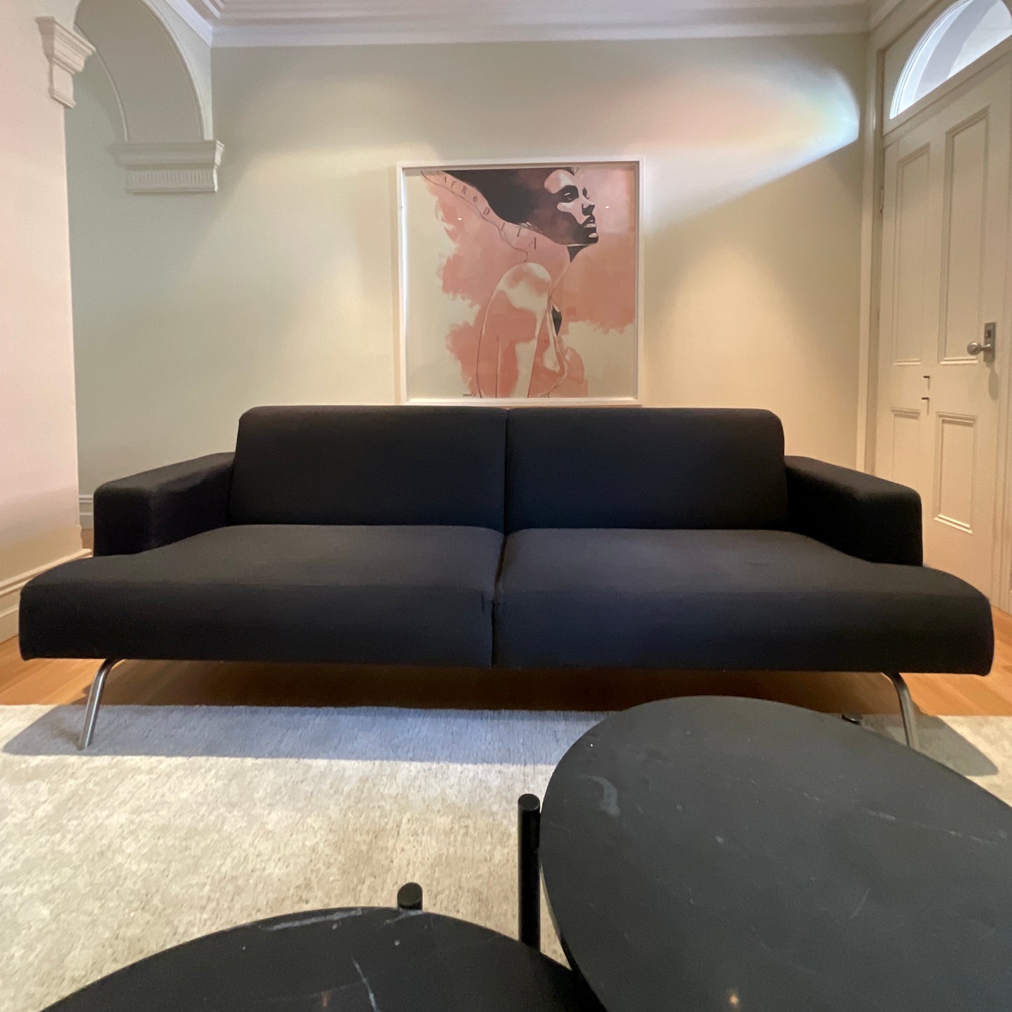 Norman + Quaine Columbia three seat sofa in black wool with steel base, pre-owned designer furniture