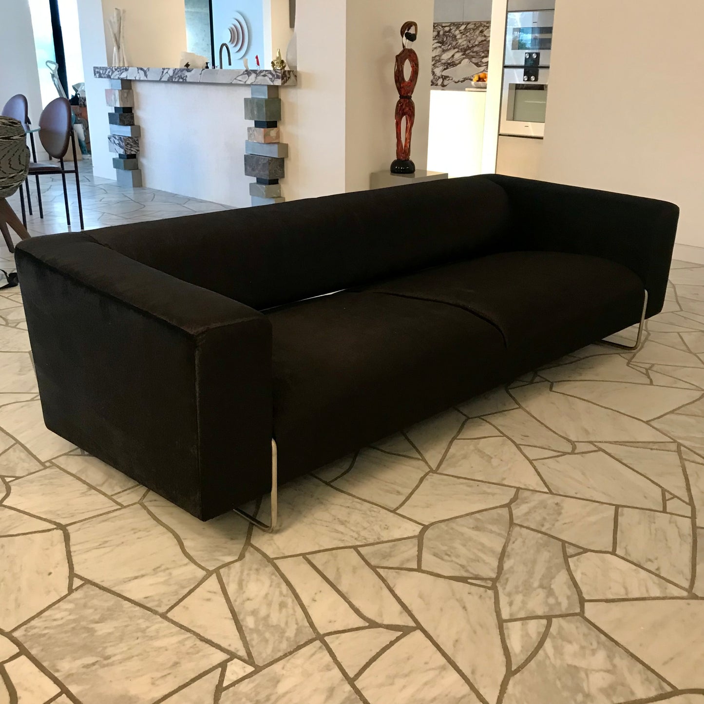 James Salmond custom three-seat sofa in black velvet with stainless steel base, pre-owned designer furniture