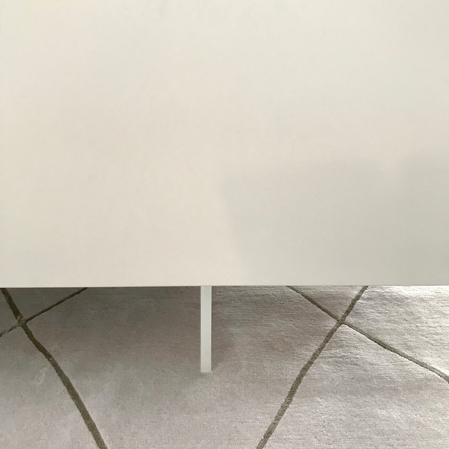 B&B Italia grey sideboard with plexiglass plinth and three doors, pre-owned designer furniture